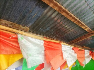 The pennant flag is kept behind the house under a tin roof