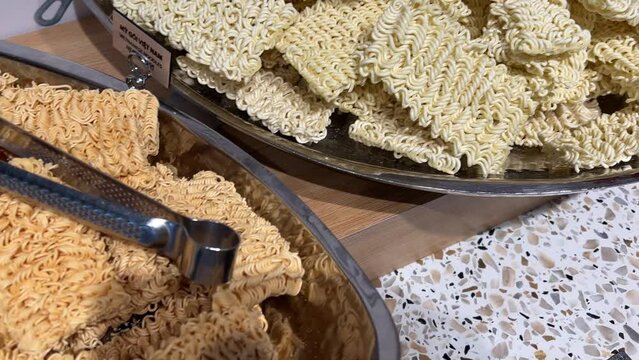 Instant noodles. Fast food, junk food, unhealthy food. Rolton. Doshirak. extremely close-up, detailed. instant wavy dry noodles. Tasty Chinese type noodles close-up