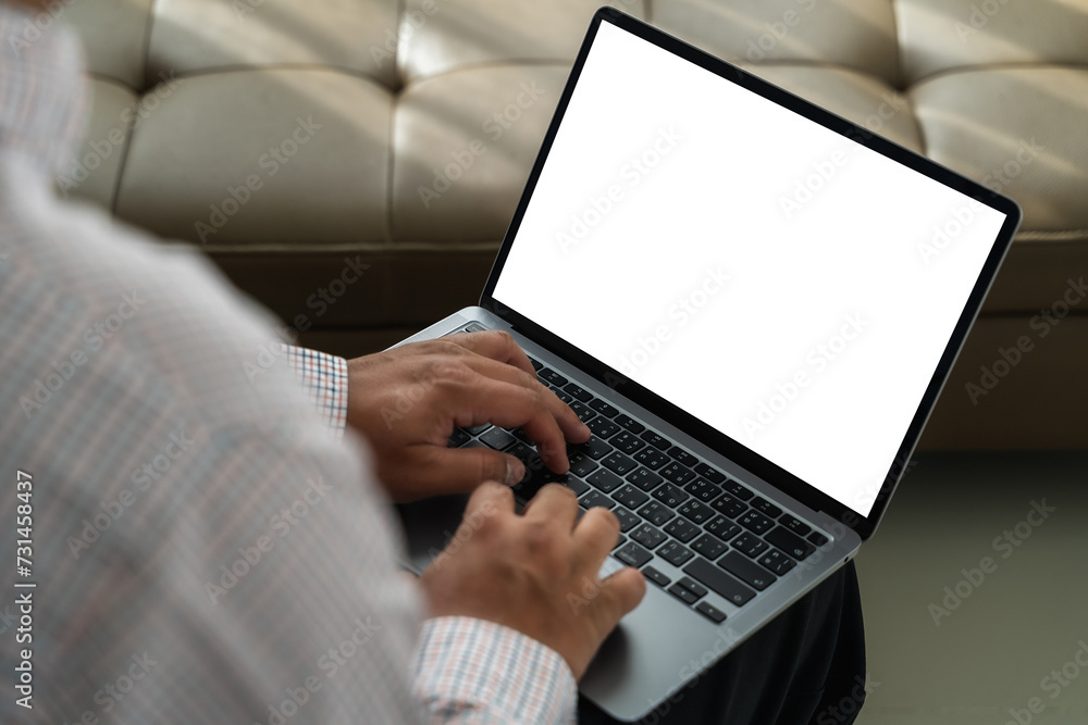 Poster back view of man working hands typing on laptop keyboard mock-up of computer monitor copyspace