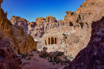 Small temple carved into the rock of a canyon in the city of Petra, Wadi Musa, Jordan.