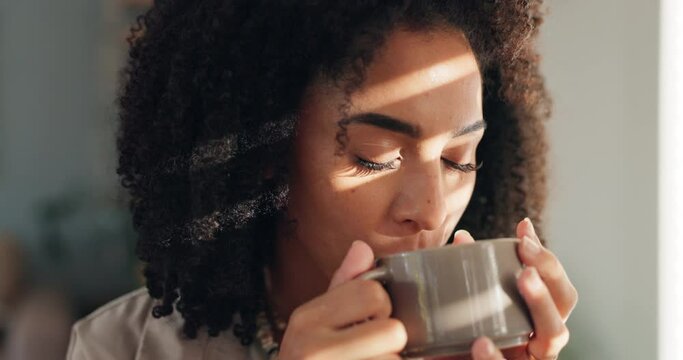 Smile, calm and woman with coffee by window in apartment for relaxing weekend morning routine. Happy, peace and young female person drinking cappuccino, tea or latte in cup with aroma at modern home.