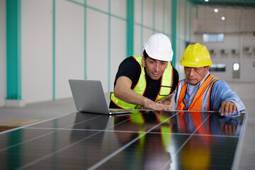 workers or technicians looking and checking solar panel in the factory