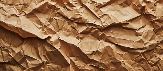A close-up of crumpled brown paper, resembling a natural material derived from wood, evokes images of cuisine, dish, and staple food.