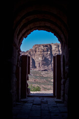 View of a landscape of mountains and desert from inside a house carved into the rock in the ancient...