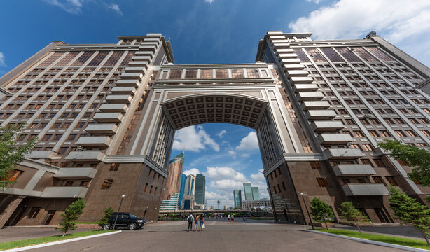  View of the central boulevard of the capital of Kazakhstan, the city of Atana, through the huge arch of an office building