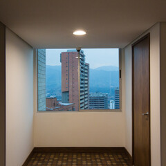 A look at buildings from inside an apartment in Medellin.