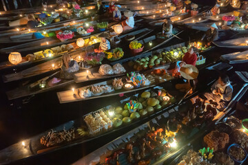 Damnoen Saduak Floating Market or Amphawa. Local people sell fruits, traditional food on boats in...