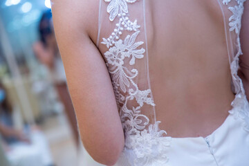 bride, wedding, dress, woman, hand, back, garter, beauty, fashion, bridal, hands, marriage, gown, love, married, lace, clothing, celebration, leg, people, detail, corset, body, bridesmaid, closeup