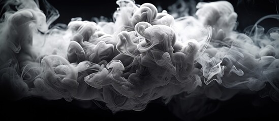 White cloud of smoke on a black background.