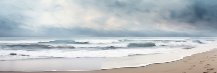 Sandy beach in nasty weather with big waves, stormy sea landscape with copyspace