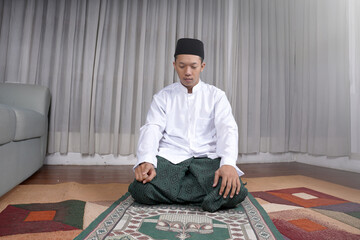 Muslim Man Praying In Tashahhud Posture