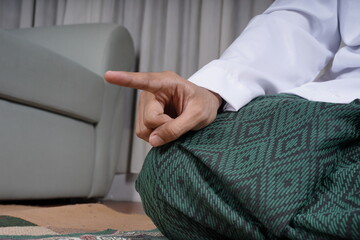Muslim Man Praying In Tashahhud Posture