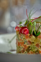 Salad with mayonnaise, chicken, peas, carrots and poached egg. A modern take on Ukrainian salad Olivier