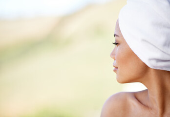 Woman, thinking and spa with towel outdoor with calm and peace from beauty and skincare treatment....