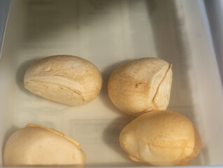 Tasty Italian food, small balls of smoked mozzarella soft cheese close up