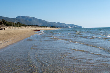 Fototapeta na wymiar Sandy beach near medieval small touristic coastal town Sperlonga and sea shore, Latina, Italy