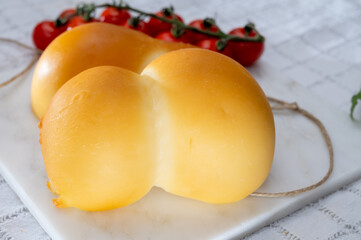 Cheese collection, Italian cheese scamorza, caciocavallo, provolone made from cow milk in South Italy yellow smoked cheese
