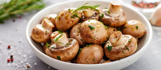 A white bowl filled with cooked mushrooms, a versatile ingredient, perfect for adding flavor and texture to various dishes.