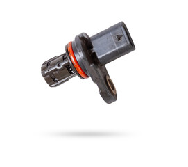 Electromagnetic crankshaft position sensor of a car engine in the hands of an auto mechanic. Spare...