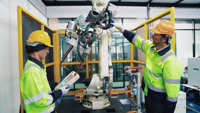 Engineer working and controlling robotics with monitoring system software automation robot arm. AI, Artificial intelligence.