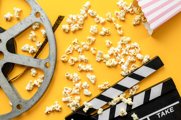 Cinema concept with film reels and popcorn. Movie background
