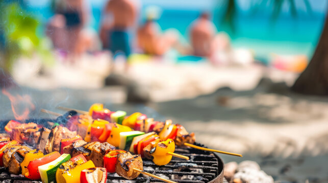Summer bbq concept image with skewers on a hot barbecue on the beach with people in background