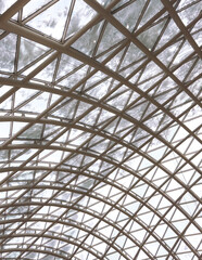 A glass roof in a building covered with snow as an abstract background. Texture