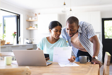 Biracial couple reviews finances at home