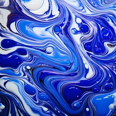 Liquid cobalt forming intricate patterns on a solid, polished marble surface