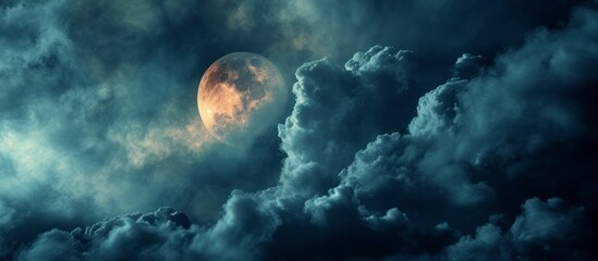 The moonlight from a full moon shines through the clouds in the night sky, creating a mesmerizing astronomical event.