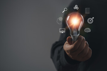 businessman hold light bulb inspired by innovative business idea, male boss or director motivated with successful startup in office, innovation, energy save concept.