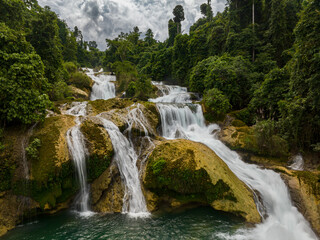 A multi-tiered waterfall with rocks. Aliwagwag Falls. Mindanao, Philippines.