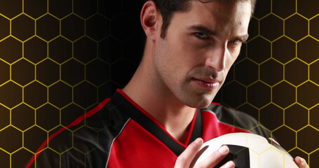 Image of hexagonal grid and light over portrait of caucasian male soccer player