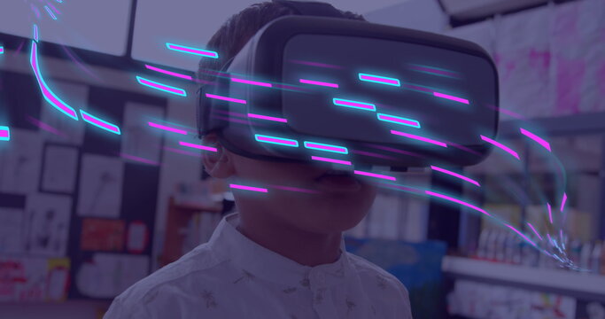 Image of glowing light trails of data transfer over biracial boy in vr headset