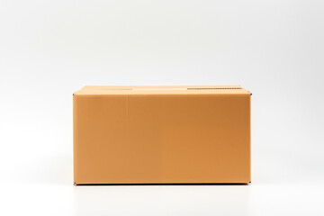 Closed cardboard box isolated on white background. With space for text