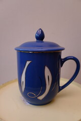 a ceramic mug with a blue color used to brew coffee