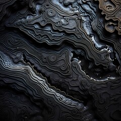Liquid obsidian forming intricate patterns on a solid, volcanic rock surface