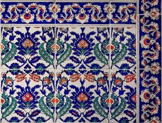 Ornate blue and red handmade Turkish Iznik mosaic tiles with floral Islamic patterns in a traditional Ottoman style in Istanbul, Turkey