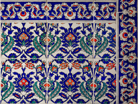 Ornate blue and red handmade Turkish Iznik mosaic tiles with floral Islamic patterns in a traditional Ottoman style in Istanbul, Turkey