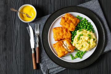 fried fish with mashed potatoes and green peas