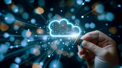 hand holds a USB stick with a glowing cloud symbol connected to it. The background is dark with an abstract pattern of blue and white lights, Cloud computing technology internet concept background