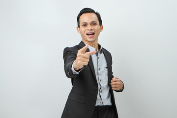 Happy confident asian indonesian business man in suit with pointing finger gesture on isolated...