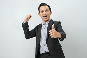 Happy confident asian indonesian business man in suit on isolated background