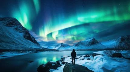 Selbstklebende Fototapete Nordeuropa A man standing and looking at the Aurora ,Hiker admiring the Northern Lights