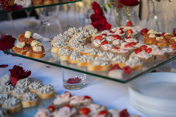 Delicious pastry with truffle cream and strawberry on the table for private event