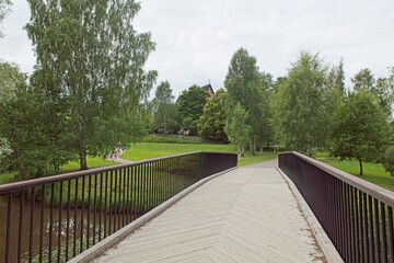 Fototapeta na wymiar Modern bridge over small river.