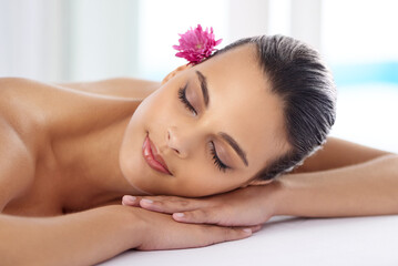 Obraz na płótnie Canvas Woman, massage and organic treatment at salon, wellness and beauty therapy for body care. Female person, relaxing and serene or dermatology, cosmetics and resting at resort hotel and peace or zen