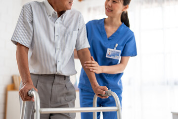 Close up of senior man patient doing physical therapy with caregiver. 