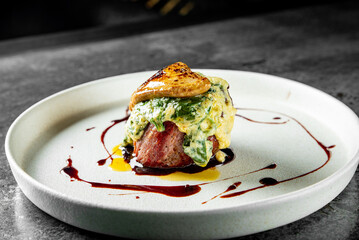 Grilled beef steak filet mignon with sauce in plate