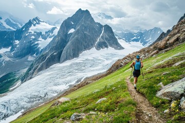 Fototapeta na wymiar Experienced runner races on mountain trail above glacier.